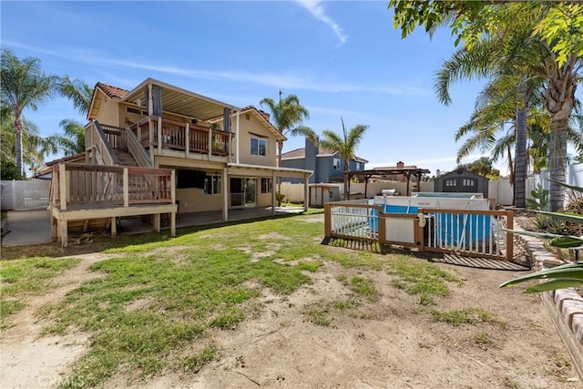 view of yard with a fenced backyard, stairway, and a deck