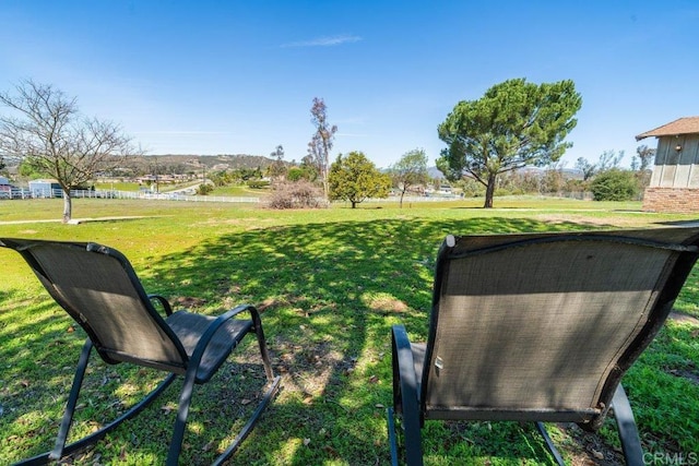 view of home's community with a lawn