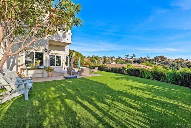 view of yard with a patio and fence