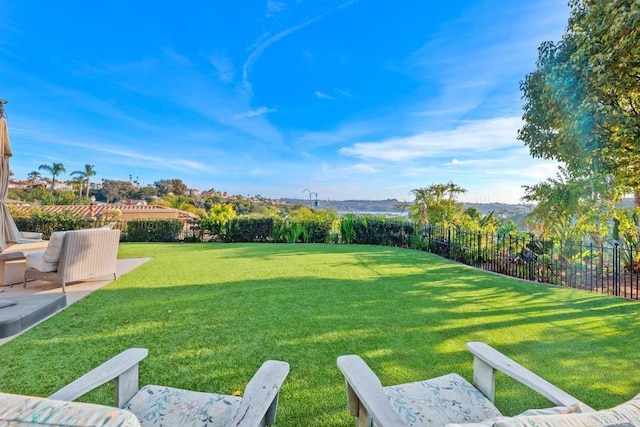 view of yard with a patio and fence