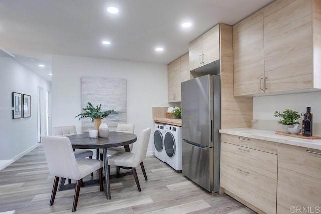 4197 Tiberon Dr, Oceanside, CA 92056 - kitchen featuring light brown cabinets, recessed lighting, freestanding refrigerator, light countertops, and washer and dryer