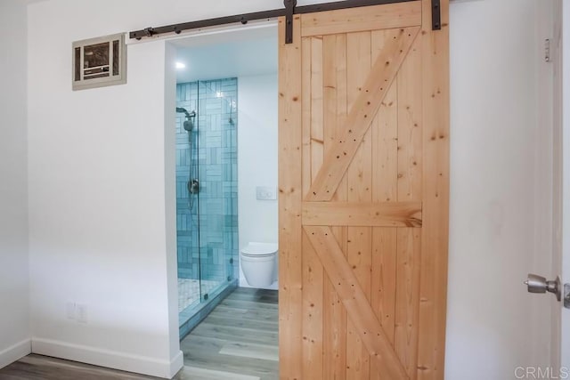 4197 Tiberon Dr, Oceanside, CA 92056 - bathroom featuring baseboards, toilet, wood finished floors, and a shower stall