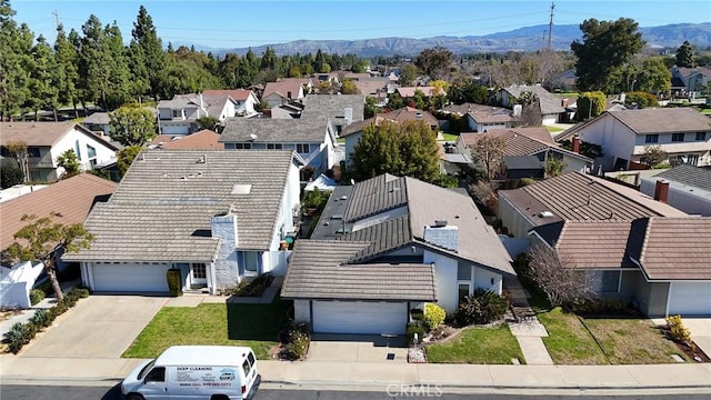 bird's eye view featuring a mountain view and a residential view