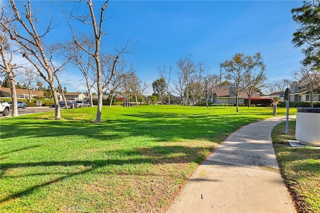 view of community featuring a residential view and a lawn