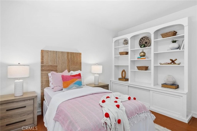 bedroom featuring wood finished floors