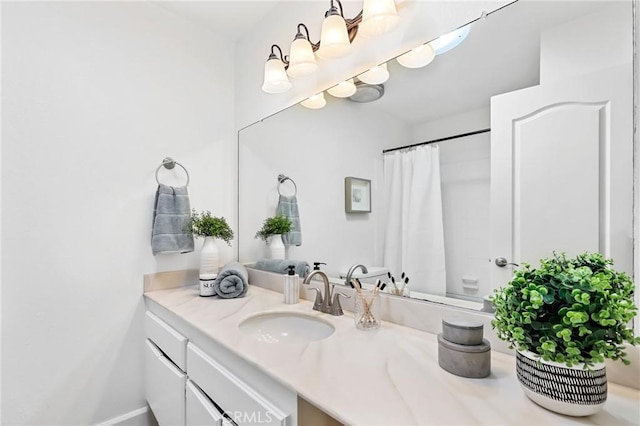 full bathroom with a shower with curtain and vanity