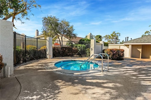 view of pool with a patio and fence