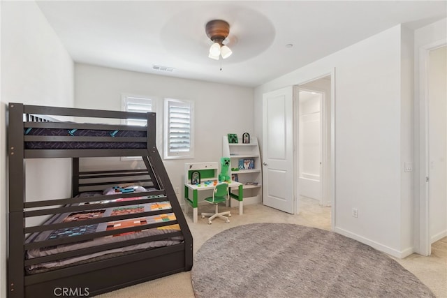 carpeted bedroom featuring baseboards and visible vents