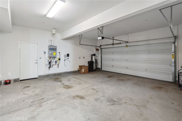 garage featuring a garage door opener and water heater