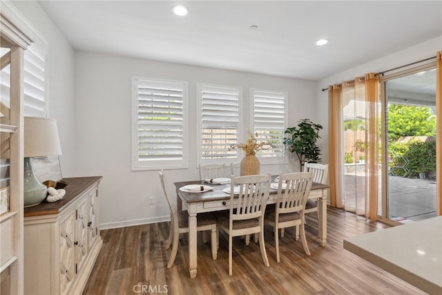 dining area with recessed lighting, baseboards, and wood finished floors