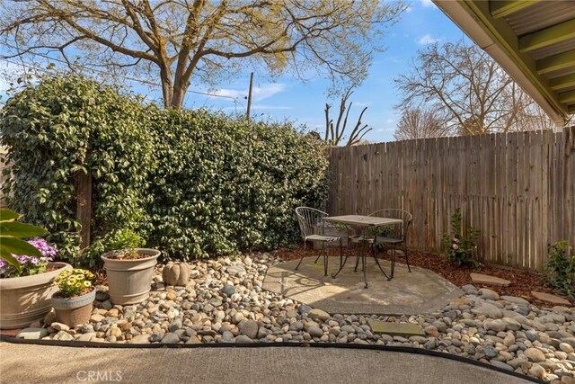 view of patio / terrace featuring fence