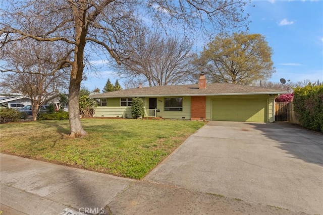 ranch-style house featuring fence, concrete driveway, a front yard, an attached garage, and a chimney