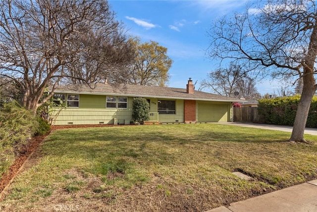 ranch-style house featuring concrete driveway, a front yard, a chimney, crawl space, and an attached garage