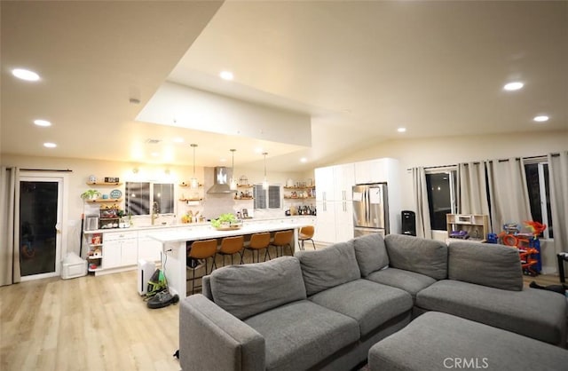 living area with recessed lighting and light wood-type flooring