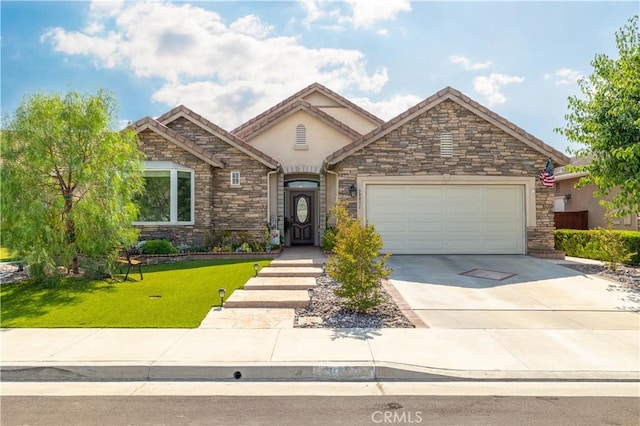 view of front of property featuring concrete driveway, a front yard, stucco siding, a garage, and stone siding