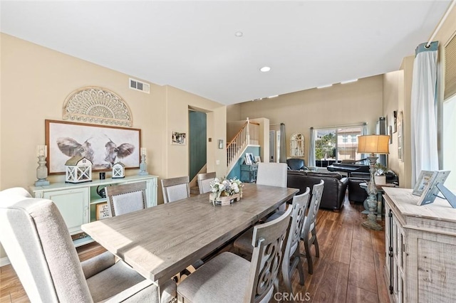 dining space with visible vents, recessed lighting, stairs, and hardwood / wood-style floors