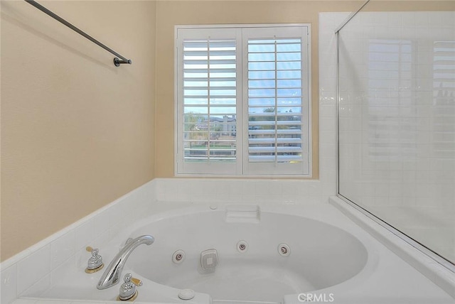 full bathroom with a whirlpool tub