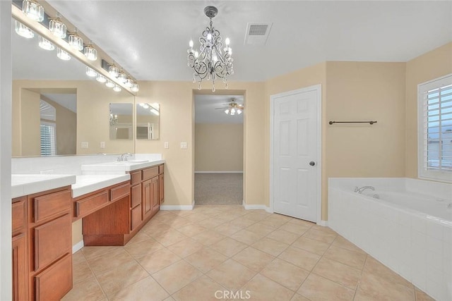 bathroom with vanity, tile patterned floors, a bath, and visible vents