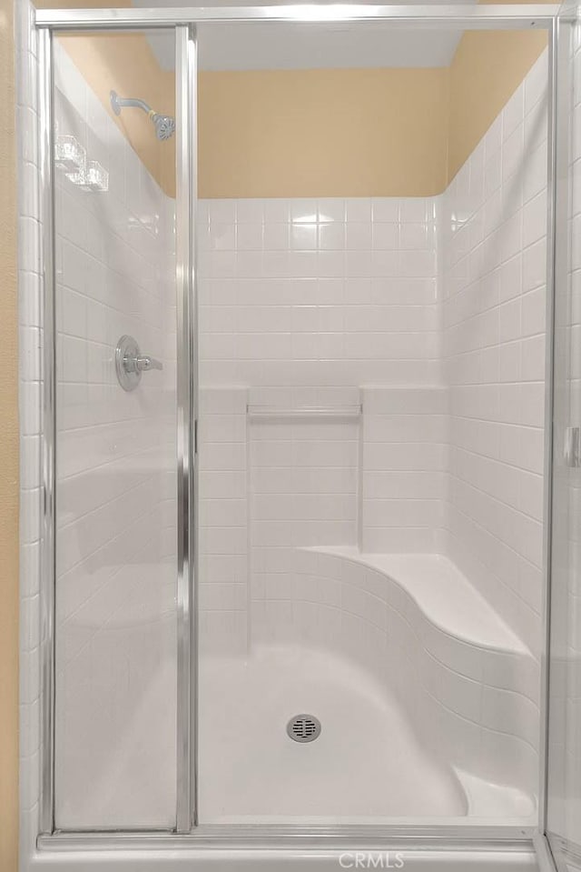 full bathroom with a shower stall