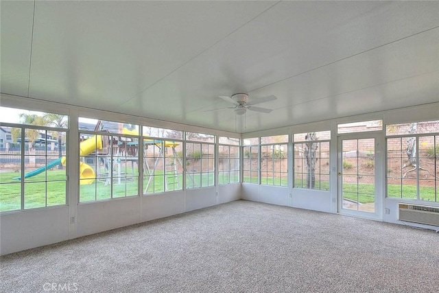 unfurnished sunroom featuring a wealth of natural light and ceiling fan