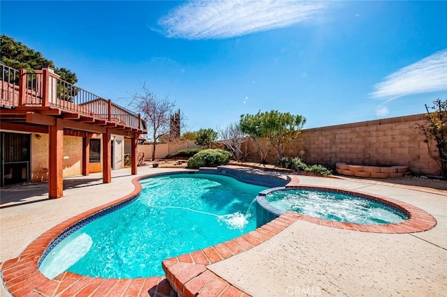 view of pool featuring a fenced backyard, a patio, a deck, and a pool with connected hot tub