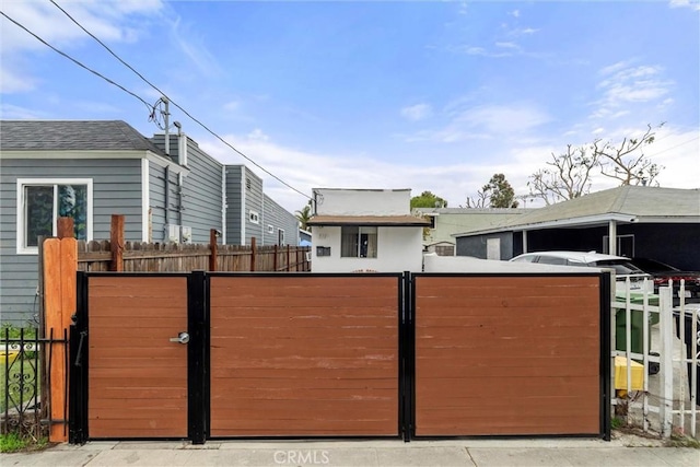 view of gate featuring fence