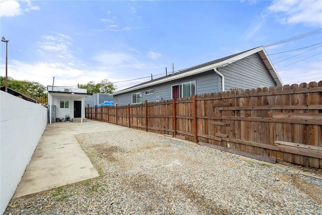 view of yard with a fenced backyard and a patio area