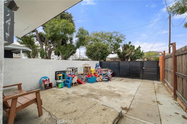 view of patio / terrace with a fenced backyard and a gate