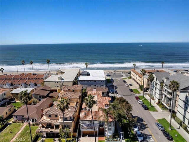 bird's eye view featuring a residential view, a view of the beach, and a water view