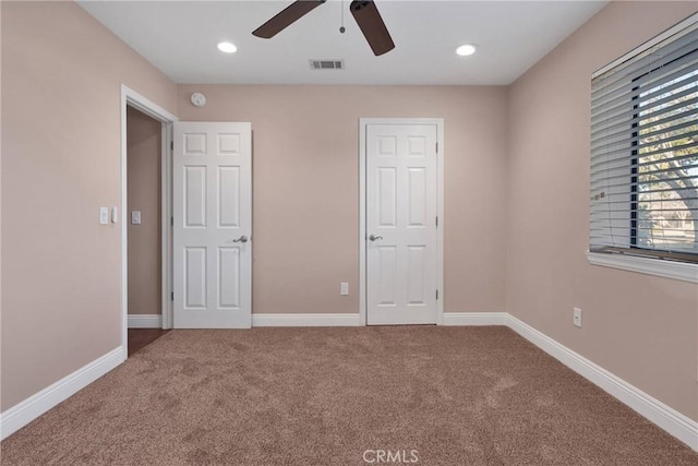 unfurnished bedroom featuring visible vents, carpet, baseboards, ceiling fan, and recessed lighting