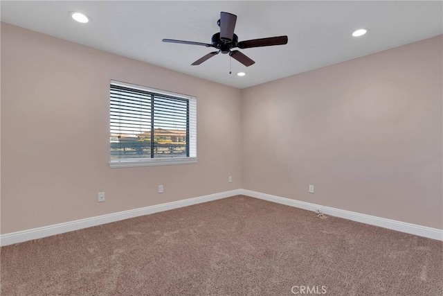 unfurnished room featuring recessed lighting, baseboards, and carpet