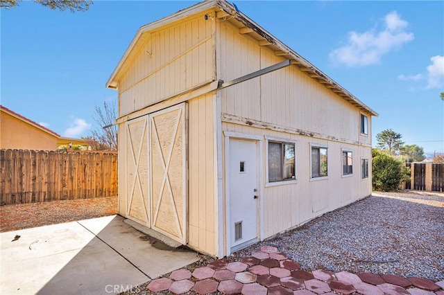 view of outdoor structure featuring an outdoor structure and fence