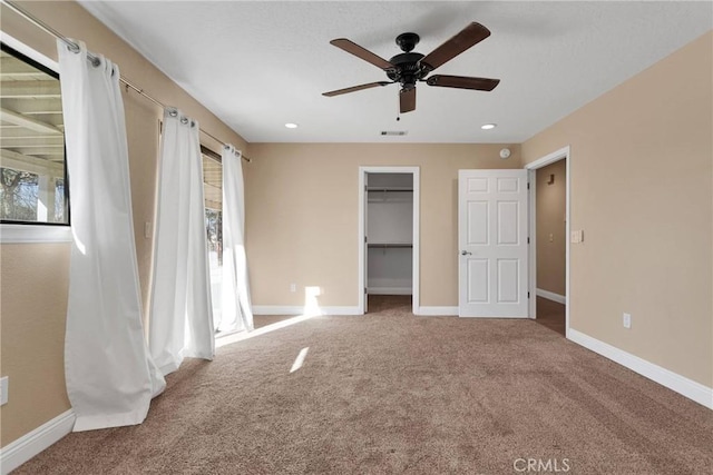 unfurnished bedroom with visible vents, recessed lighting, carpet floors, baseboards, and ceiling fan