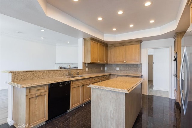 kitchen with black appliances, a peninsula, a raised ceiling, and a sink