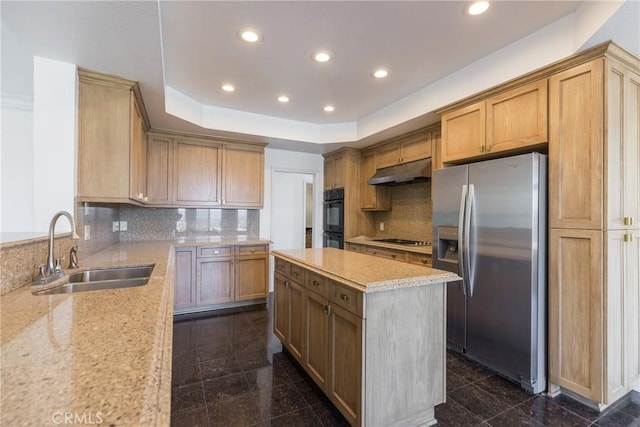 kitchen with under cabinet range hood, stainless steel refrigerator with ice dispenser, granite finish floor, gas cooktop, and a sink