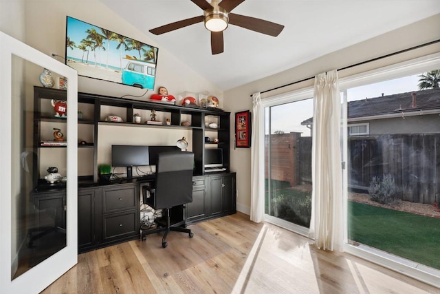 office space featuring vaulted ceiling, light wood-style floors, and ceiling fan