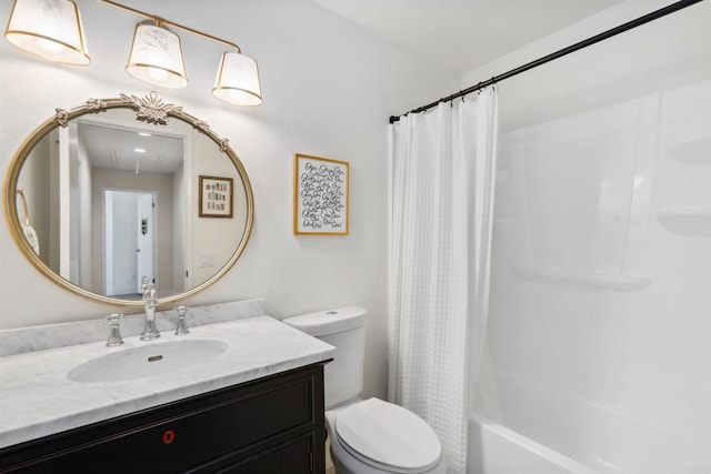 bathroom featuring vanity, toilet, and shower / tub combo with curtain