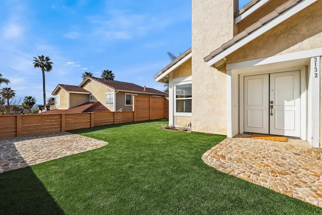 view of yard featuring a patio area and fence