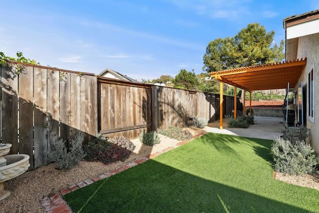 view of yard with a fenced backyard, a pergola, and a patio