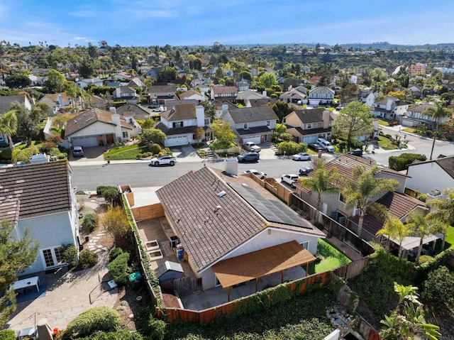 birds eye view of property with a residential view