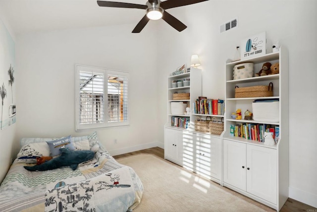 bedroom featuring visible vents, ceiling fan, baseboards, and vaulted ceiling