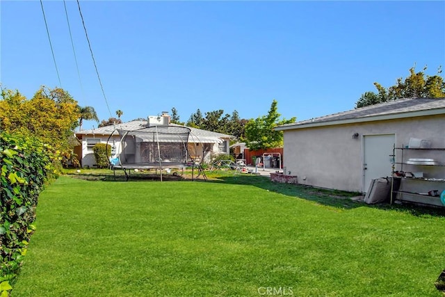 view of yard featuring a trampoline