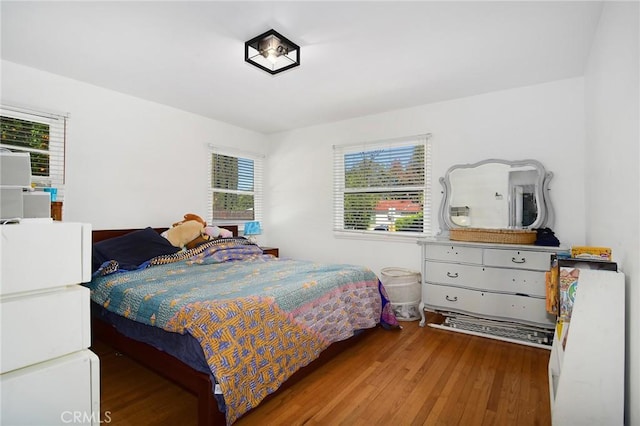 bedroom with wood finished floors