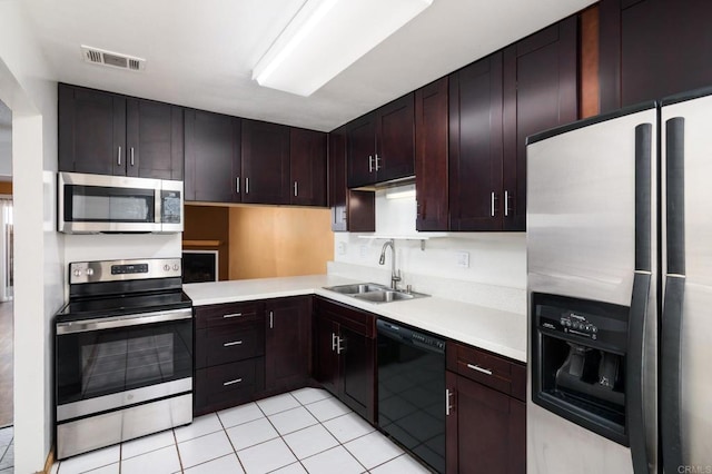 kitchen featuring a sink, light countertops, visible vents, and stainless steel appliances