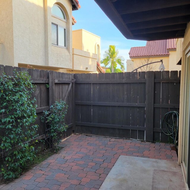 view of patio featuring fence