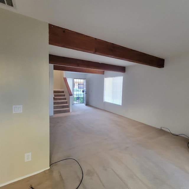 interior space with visible vents, carpet floors, and stairs