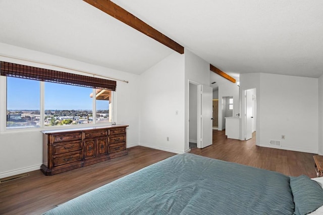 bedroom with lofted ceiling with beams, wood finished floors, and visible vents