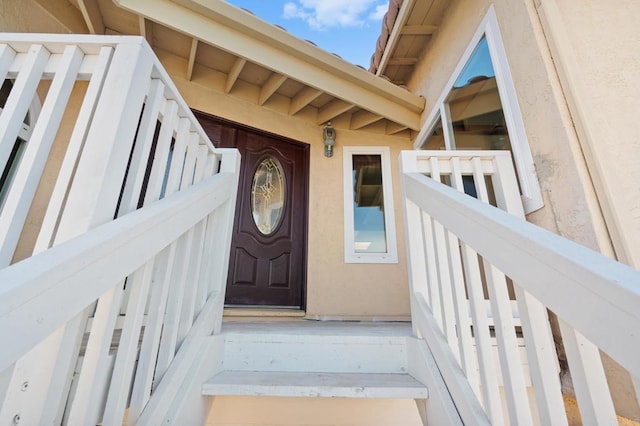 doorway to property with stucco siding