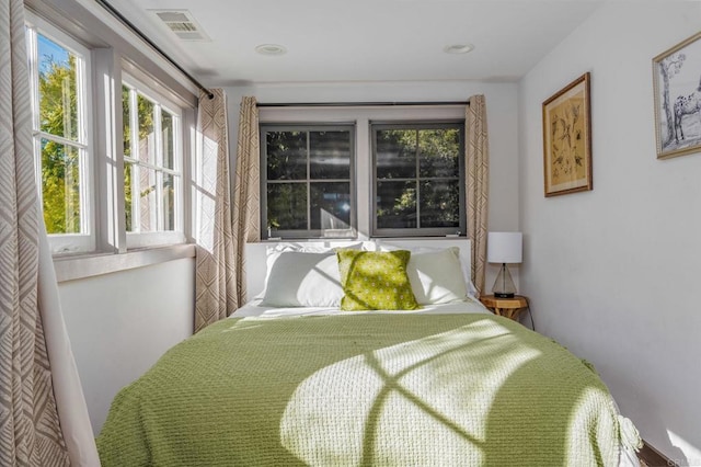 bedroom featuring visible vents