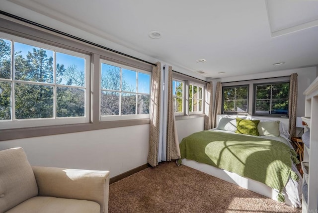 carpeted bedroom featuring recessed lighting and baseboards